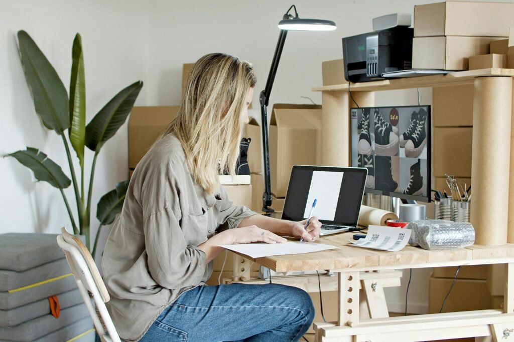 pexels-photo-7289718-7289718 A young woman managing her online store startup, working diligently from her home office in Portugal.
