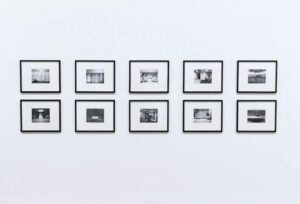 Simple and elegant wall display with black and white framed photographs in a modern interior.